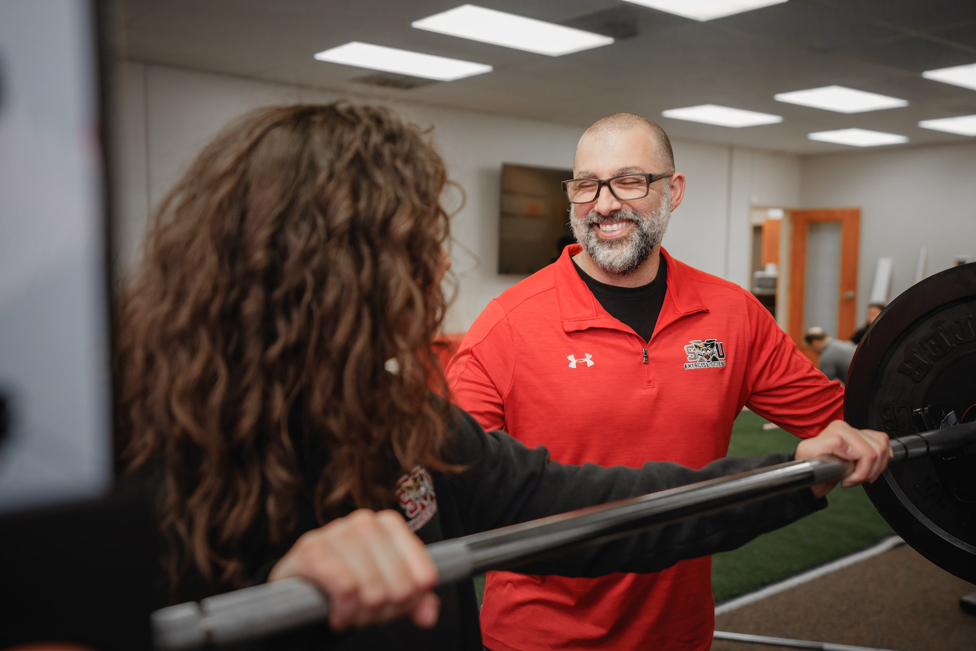 Student Lifting Weights