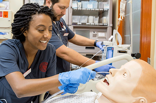 Nursing student working in simulation lab