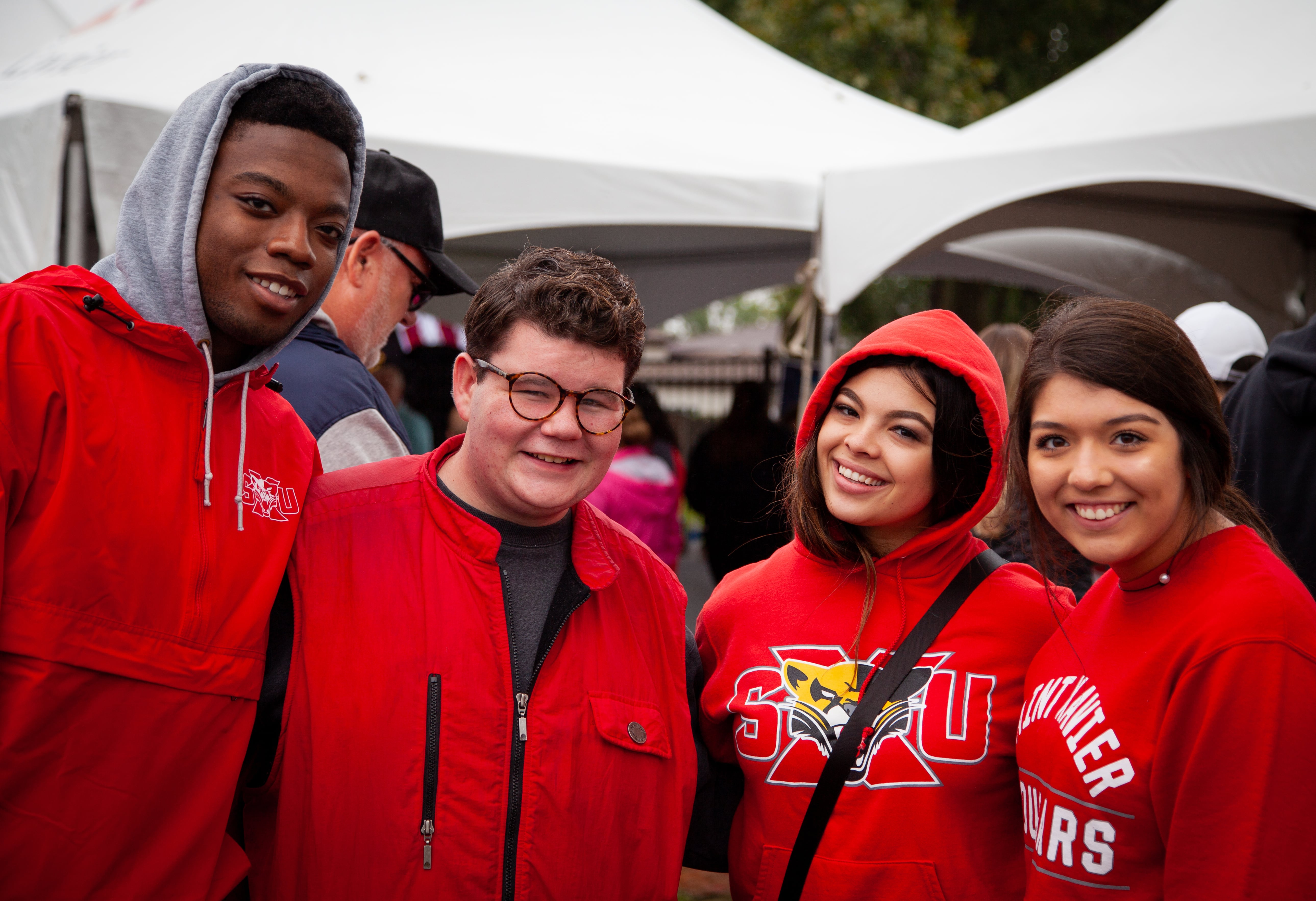 Students at Homecoming Tent