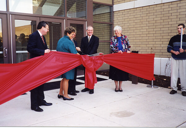 Shannon center ribbon cutting ceremony in front of the Shannon Center with a big bow