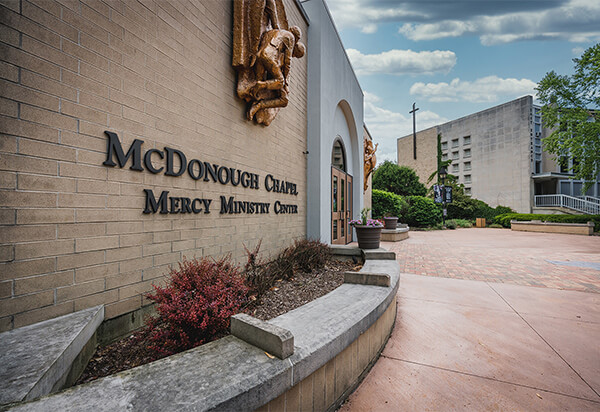 Picture of the side of the Mercy Ministry Center with a blue sky