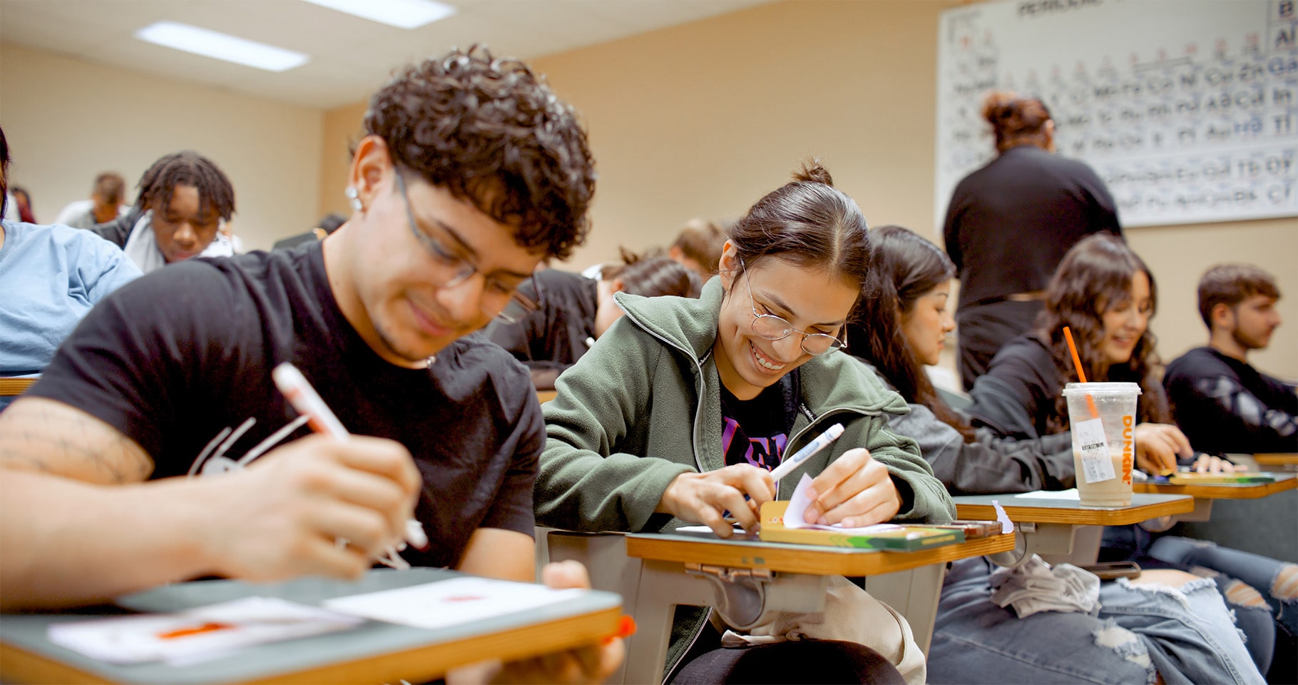Students taking notes in a class