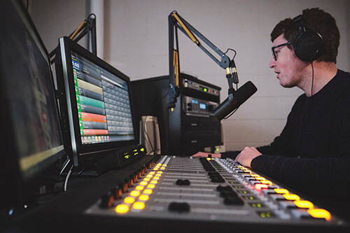 Pete Kreten, working at the radio station, WXAV