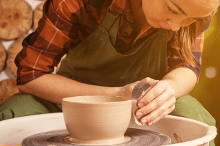 Student doing pottery