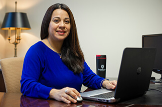 adult student in front of computer