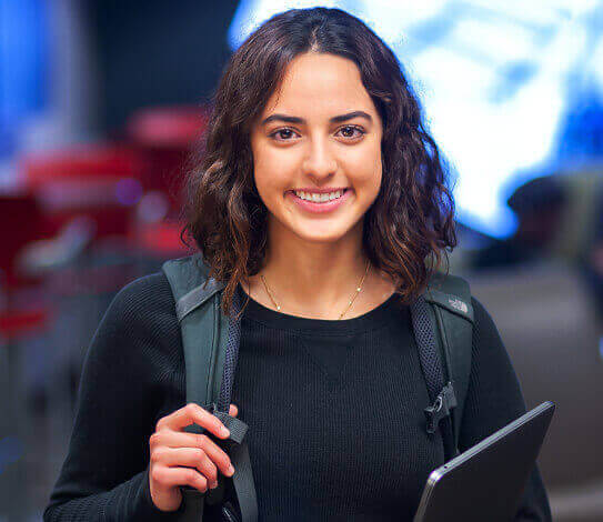 Student with backpack and tablet 