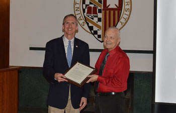 https://www.sxu.edu/news/articles/2019/images/hallberg-retirement-with-congressman-lipinski-in-post.jpg